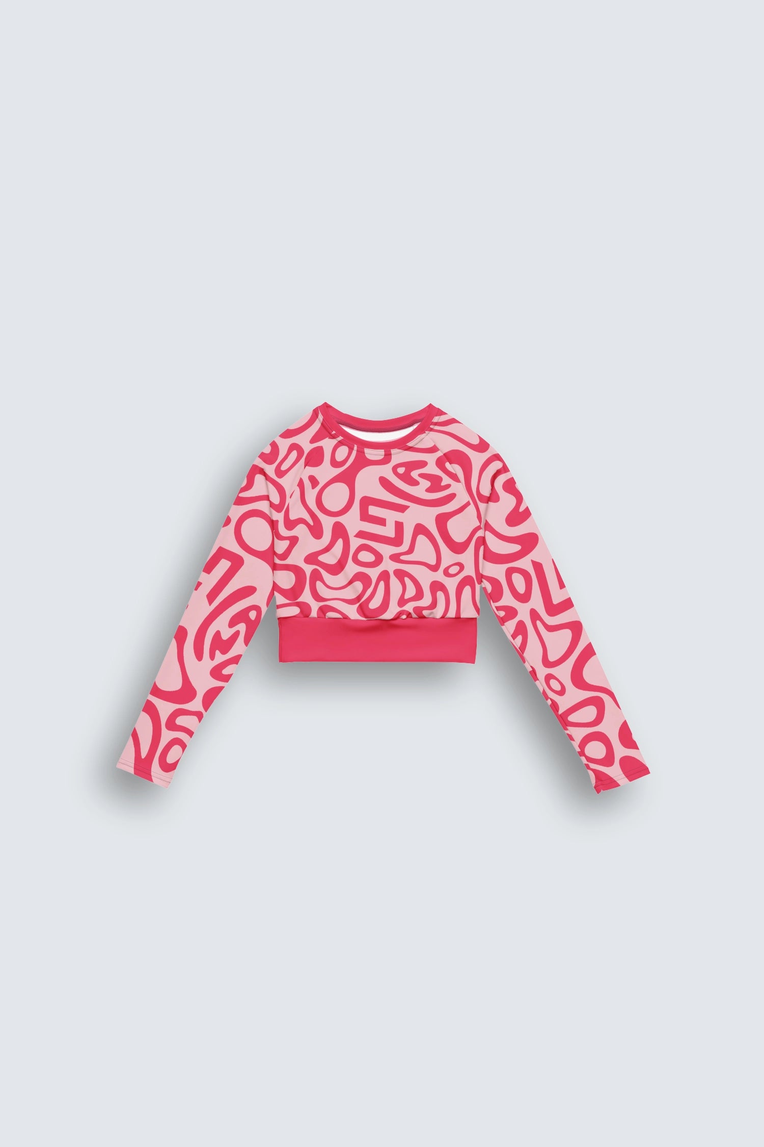 Pink patterned sweater on a light gray background